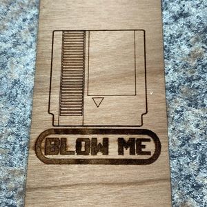 Fun wooden bookmark. Blow Me with a Nintendo cartridge